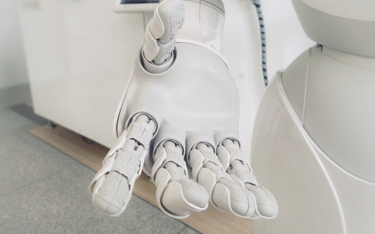 Robotic hand representing AI automation